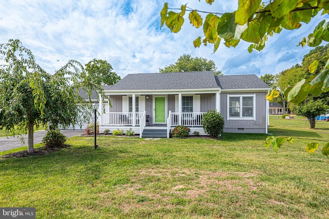 single story home with a front yard and covered porch