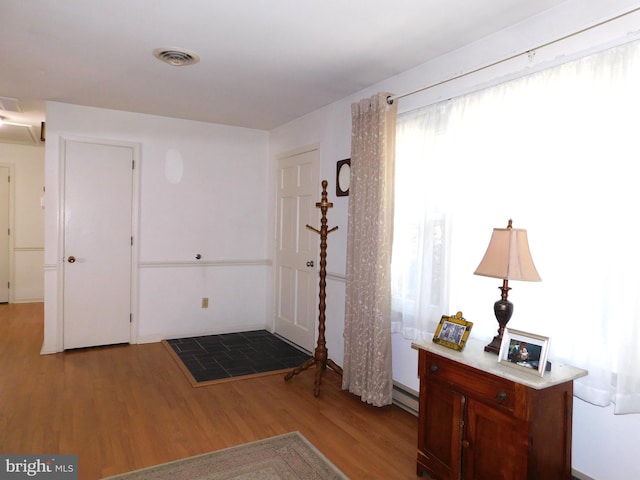 entryway featuring a baseboard radiator and light wood-type flooring