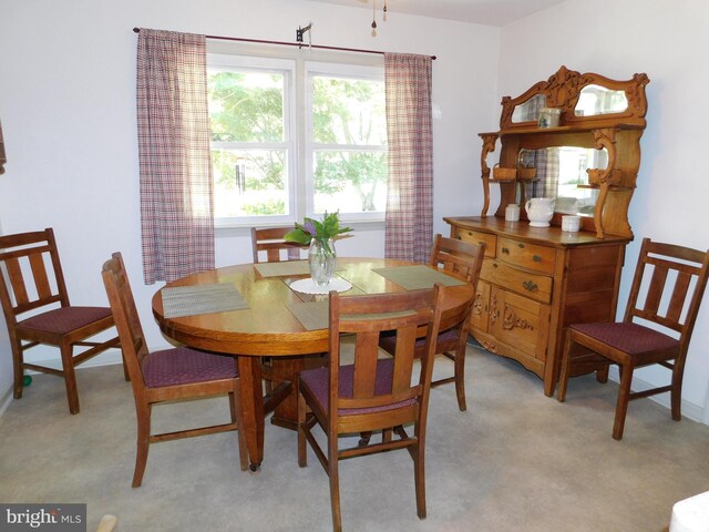 view of carpeted dining area