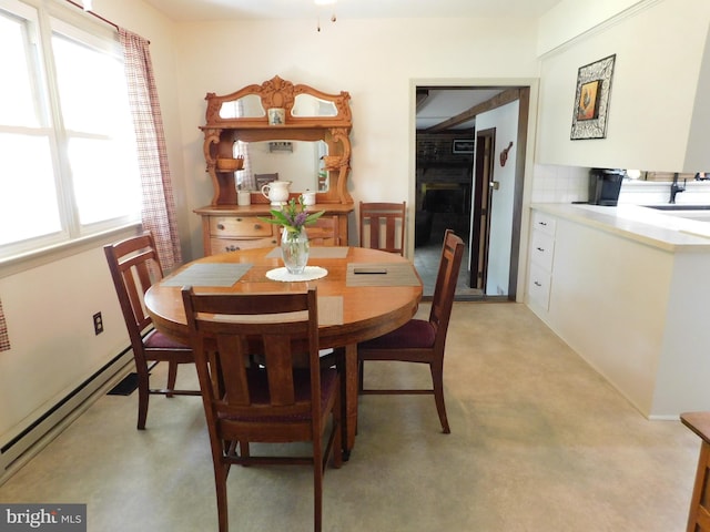 dining area featuring a baseboard radiator