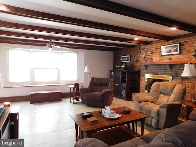 living room with ceiling fan, a fireplace, and beam ceiling