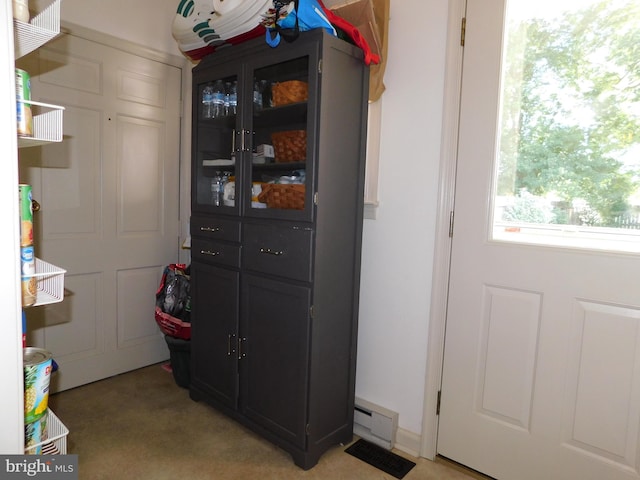 interior space with a baseboard radiator