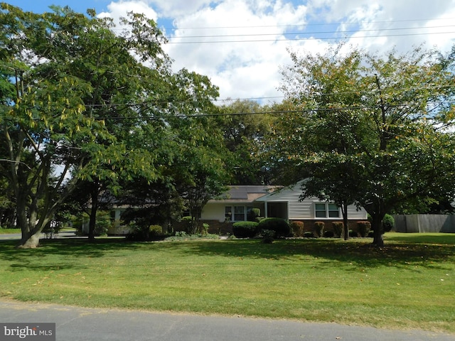 view of front of house with a front lawn