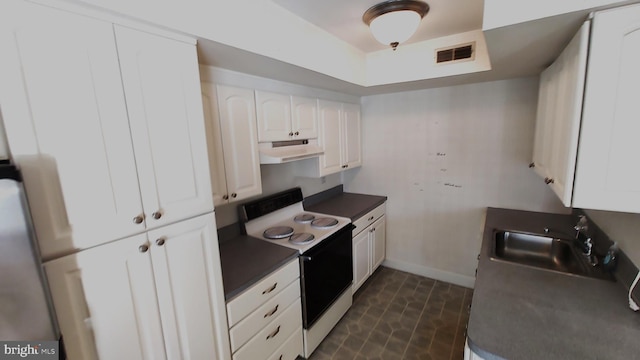 kitchen with white cabinets, sink, and electric stove