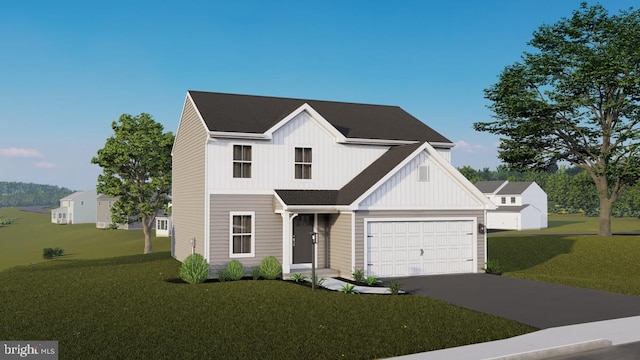 view of front of home with a garage and a front yard