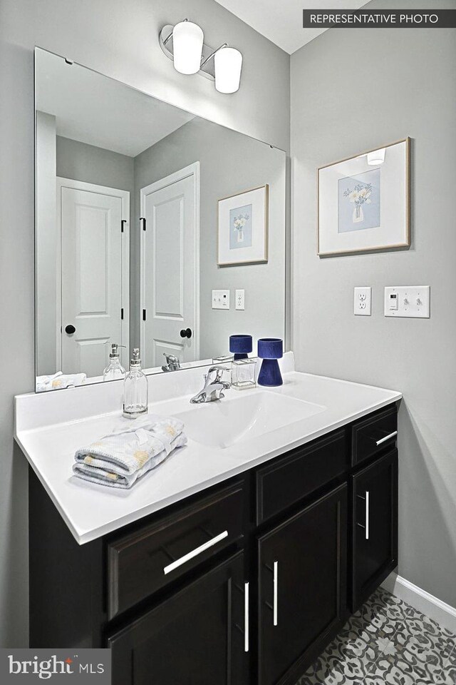 bathroom with vanity and tile patterned floors