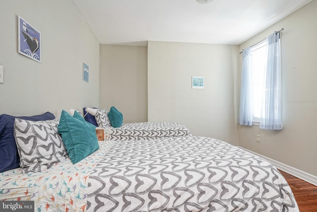 bedroom with hardwood / wood-style floors