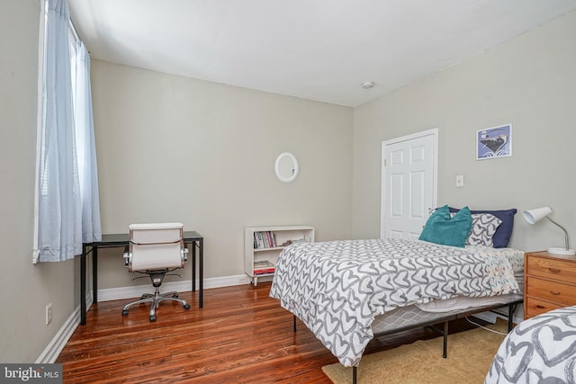 bedroom featuring dark hardwood / wood-style floors