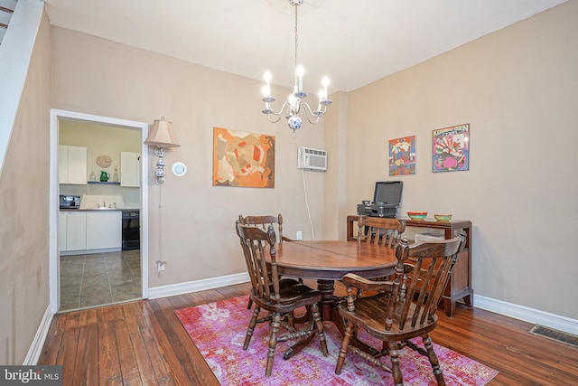 dining space featuring a notable chandelier, hardwood / wood-style floors, and a wall mounted air conditioner