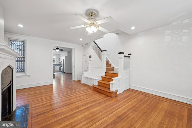 interior space featuring hardwood / wood-style flooring and ceiling fan