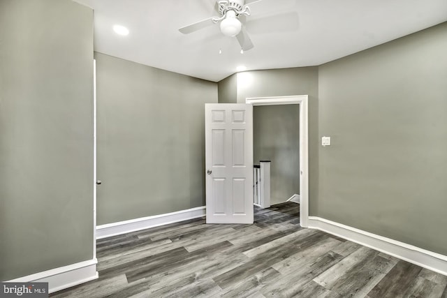 empty room featuring ceiling fan and dark hardwood / wood-style floors