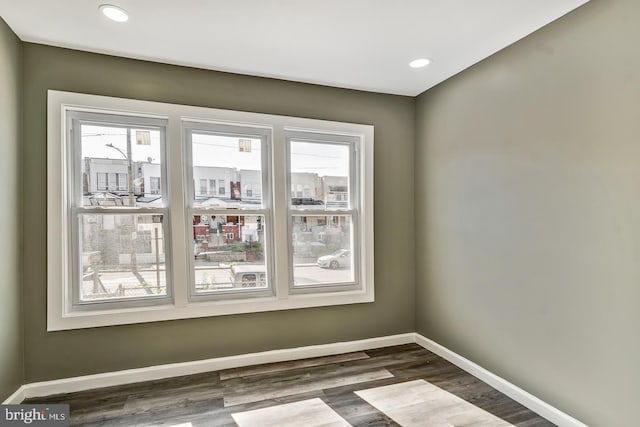 unfurnished room with dark hardwood / wood-style floors