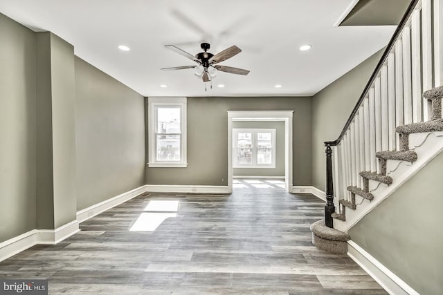 entrance foyer featuring ceiling fan and wood-type flooring