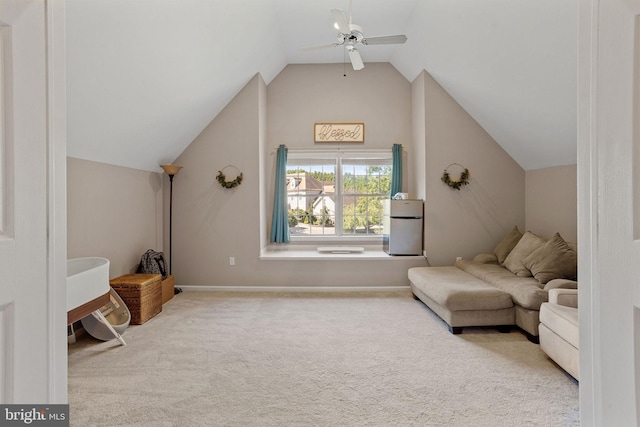 sitting room with light colored carpet, lofted ceiling, and ceiling fan