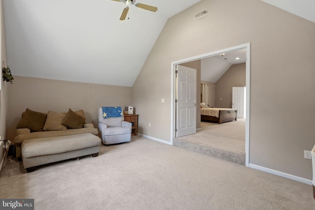 living room featuring lofted ceiling, ceiling fan, and carpet