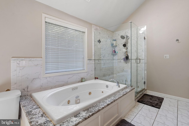 bathroom with shower with separate bathtub