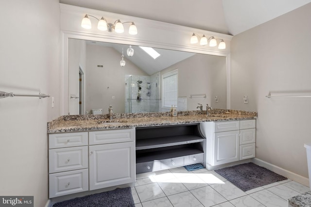 bathroom with a shower with door, vanity, and lofted ceiling with skylight