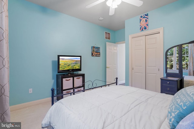 carpeted bedroom with a closet and ceiling fan