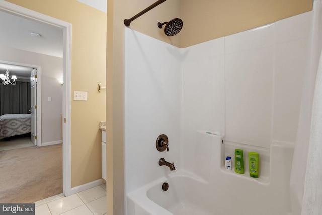 bathroom featuring shower / bathtub combination, tile patterned floors, and vanity