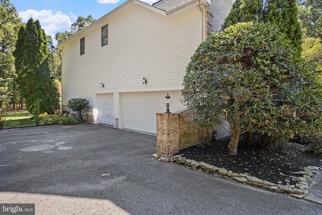 view of home's exterior featuring a garage