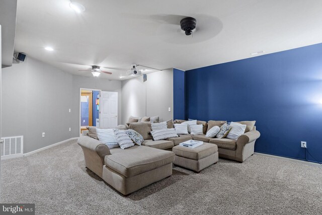 carpeted living room featuring ceiling fan