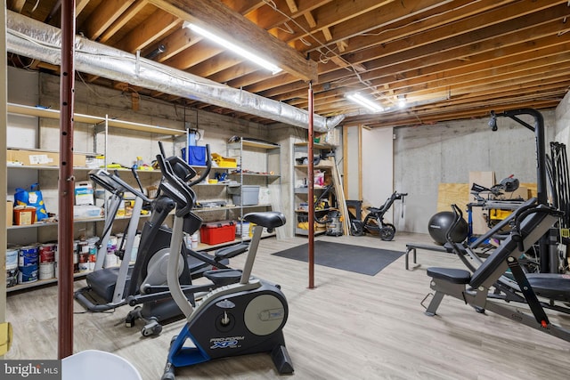 exercise area with light wood-type flooring