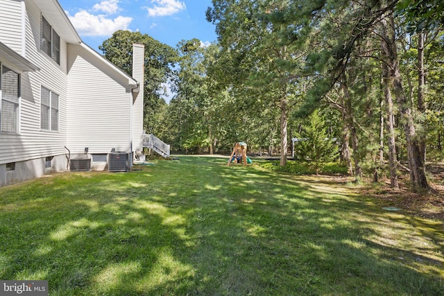 view of yard with central AC