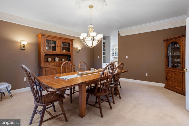 dining space featuring a notable chandelier, crown molding, and light carpet