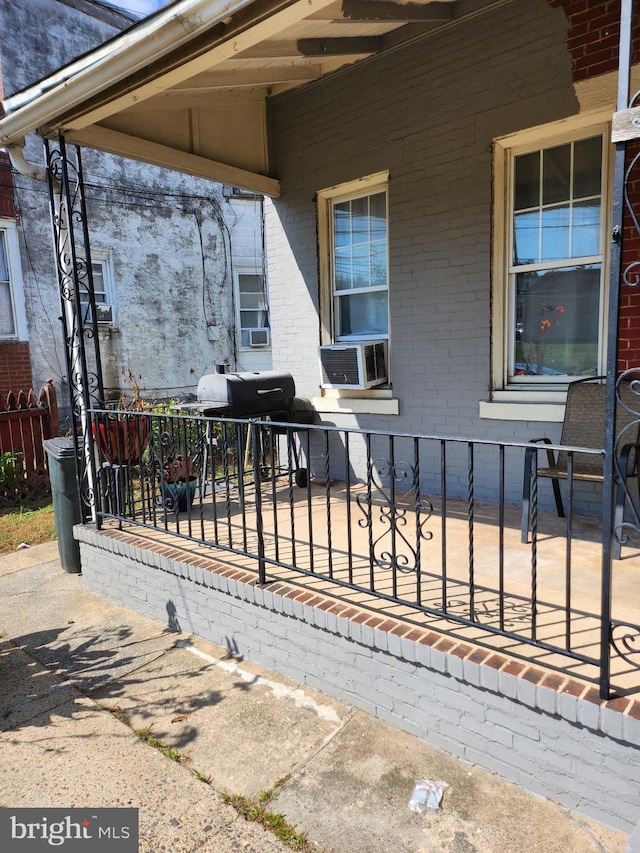 view of patio with area for grilling and cooling unit