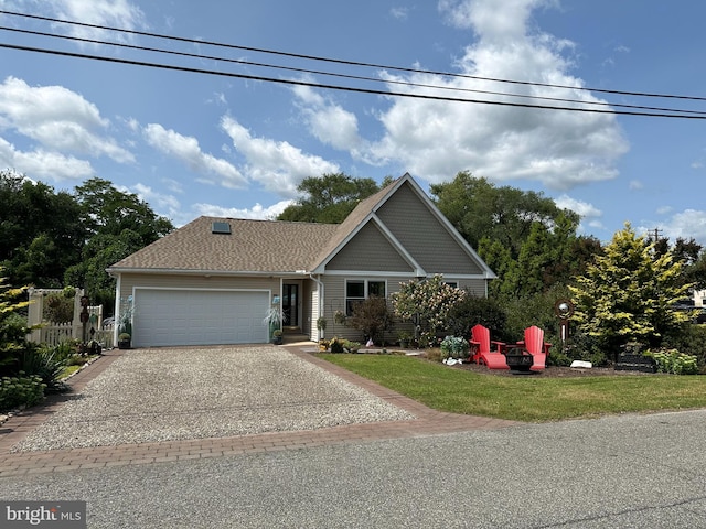 view of front of home featuring a garage and a front lawn