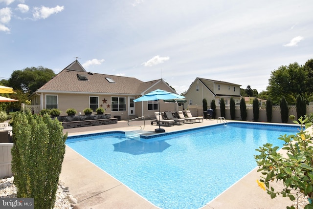 view of swimming pool featuring a patio area