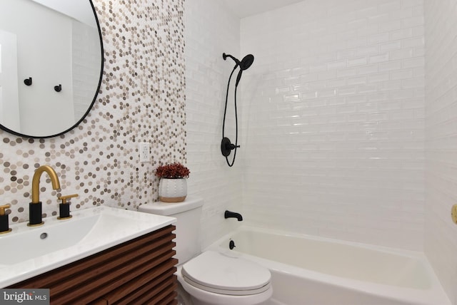 full bathroom featuring tile walls, backsplash, tiled shower / bath combo, vanity, and toilet