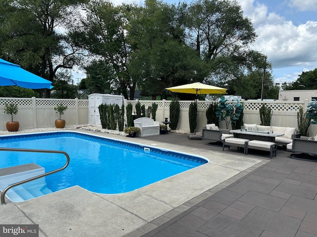 view of pool featuring an outdoor living space and a patio area