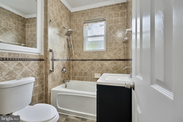 full bathroom featuring ornamental molding, toilet, vanity, tile walls, and tiled shower / bath