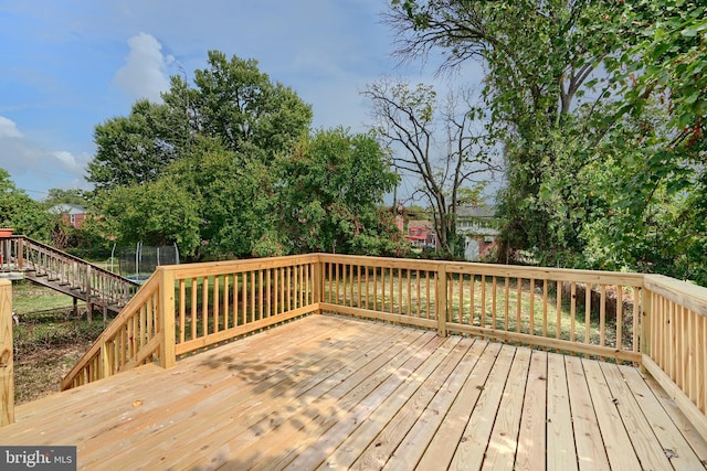 wooden terrace featuring a trampoline