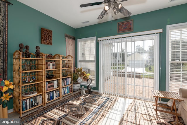 sitting room featuring ceiling fan