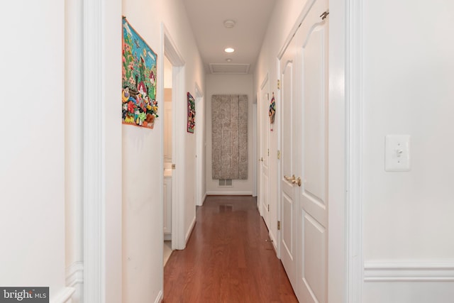 hallway featuring dark hardwood / wood-style flooring