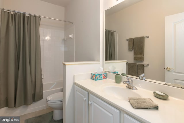 full bathroom with vanity, toilet, tile patterned floors, and shower / tub combo