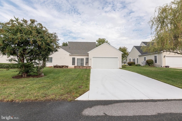 view of front of property featuring a garage and a front lawn