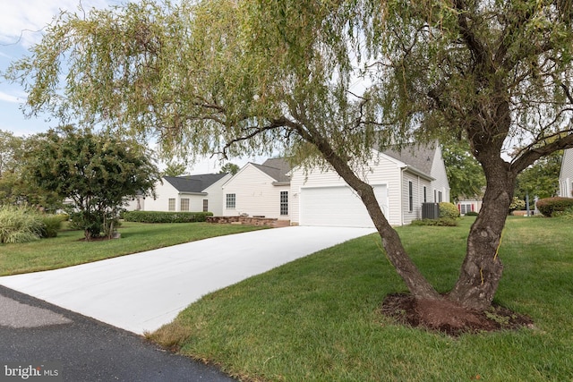 ranch-style home featuring a front yard and a garage