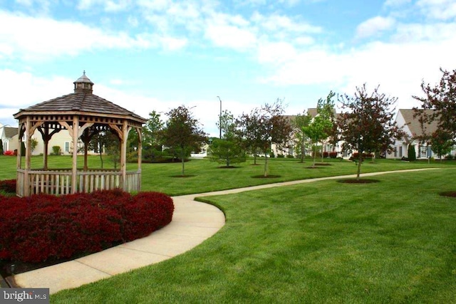 view of property's community featuring a gazebo and a yard