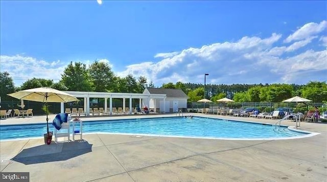 view of swimming pool featuring a patio