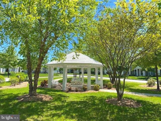 view of community featuring a gazebo and a lawn