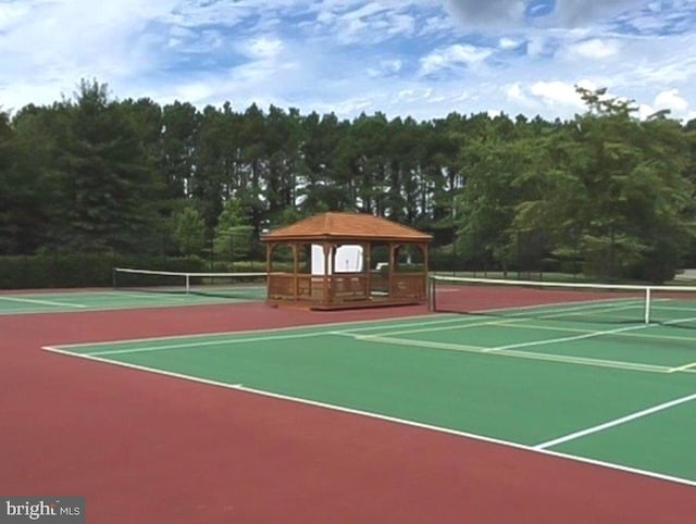 view of tennis court with a gazebo and basketball court