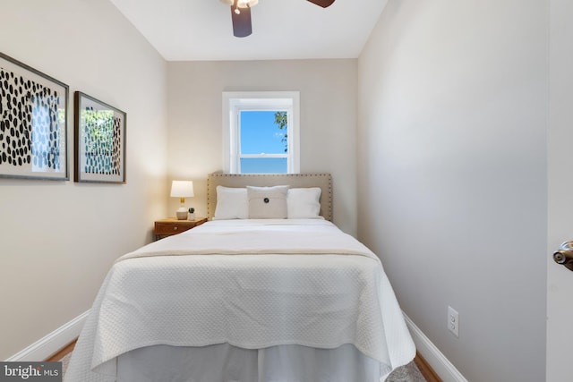 bedroom with ceiling fan and hardwood / wood-style flooring