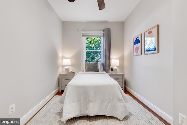 bedroom featuring light hardwood / wood-style floors and ceiling fan