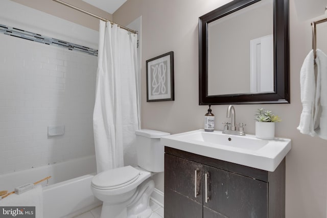 full bathroom featuring shower / bath combo with shower curtain, tile patterned floors, vanity, and toilet