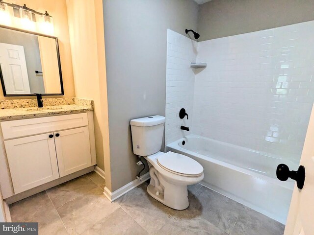 full bathroom with vanity, toilet, tiled shower / bath combo, and tile patterned floors