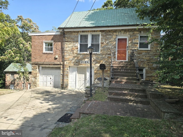 view of front of property with a garage