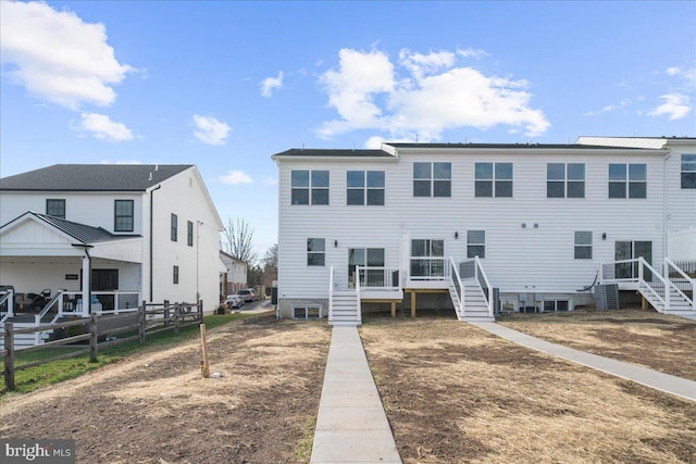 view of front of home with a wooden deck